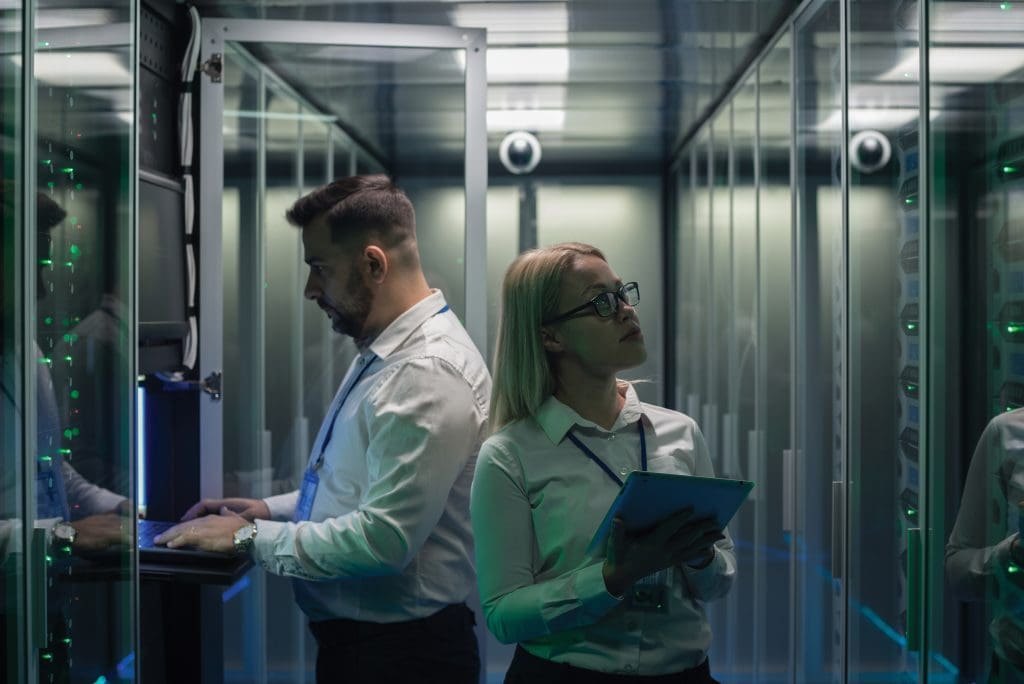 Data center colleagues with tablets